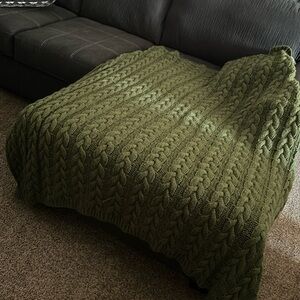 Green knitted throw blanket